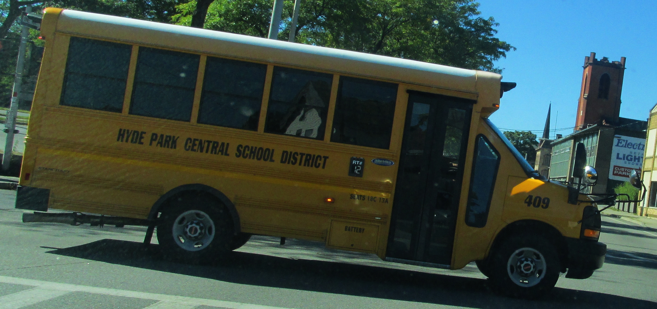 a school bus is going down the street