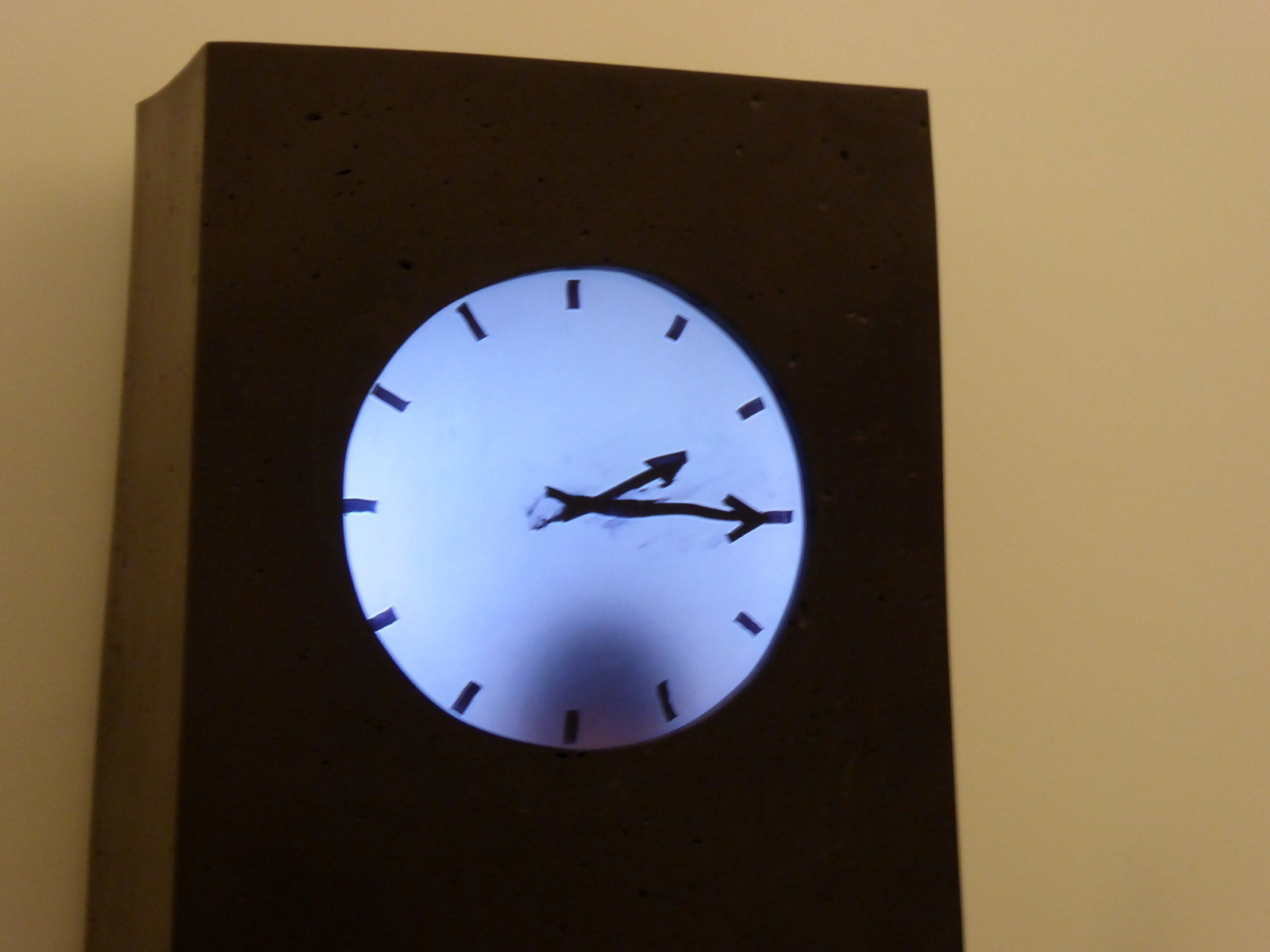 there is a clock on the wall showing time