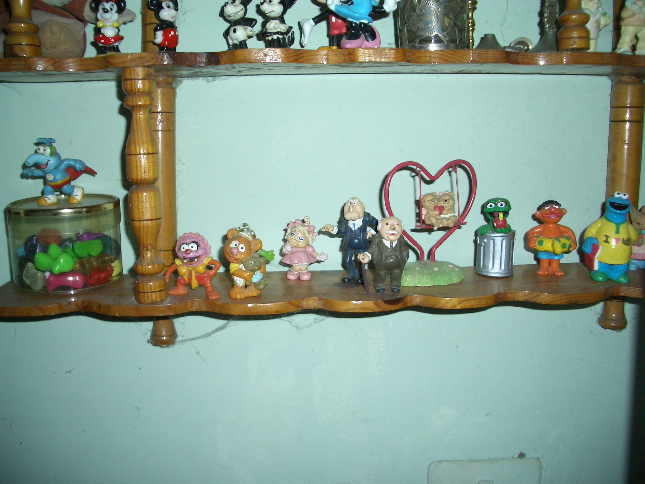 shelves filled with figurines and small figurines on them