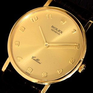 a yellow watch with arabic numerals and gold face