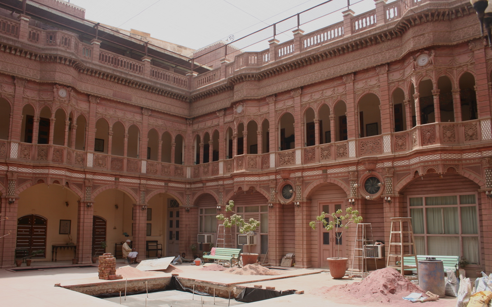 an outside view of a big building with many windows