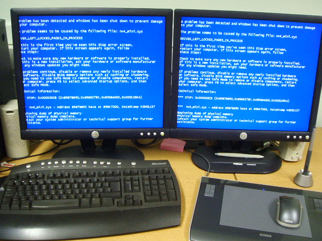 two computers are shown with the same blue screen
