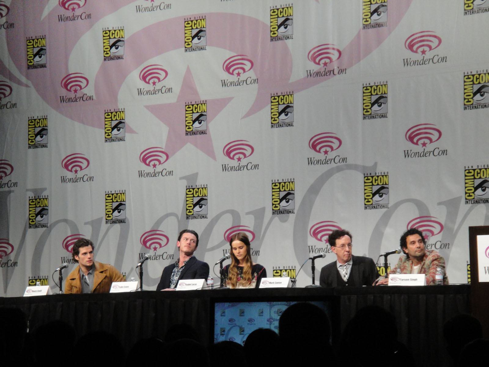 a number of people on stage with microphones