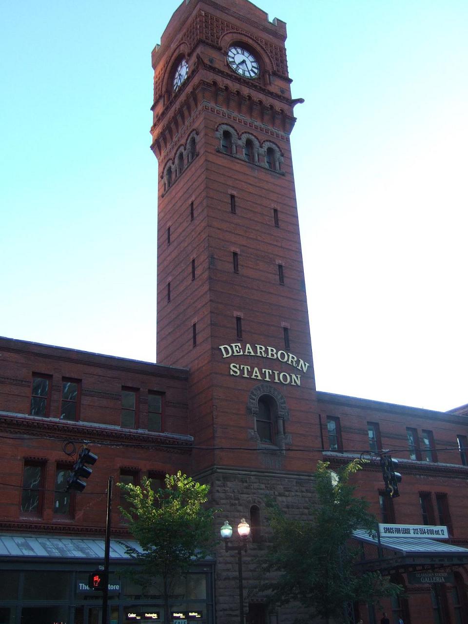 an old brick building with a tower with a clock