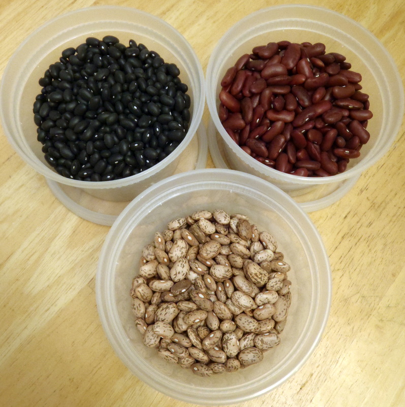 three containers with peanuts, beans, and peanuts