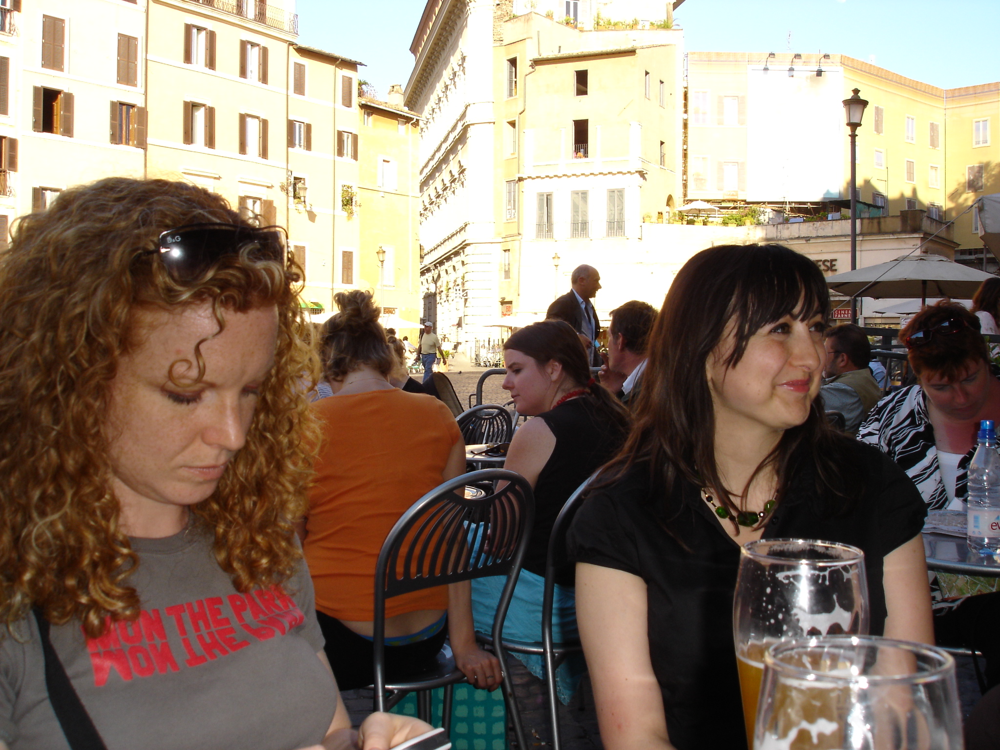 people sit together at tables and wait for soing