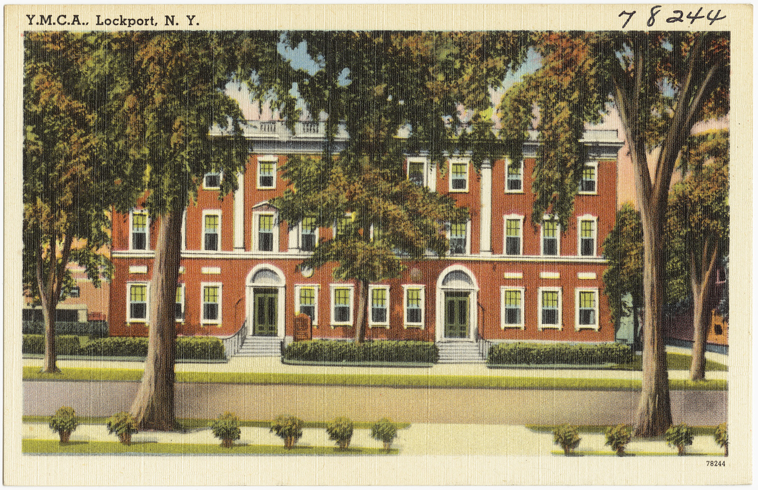 an old postcard with an image of the front of a red brick house