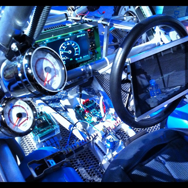 a car dashboard with some control panel and other equipment