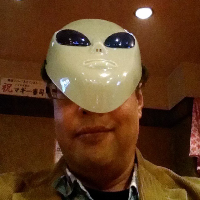 man has a weird mask with his eyes closed