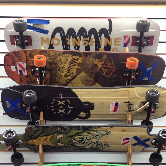 five skateboards with some different design displayed