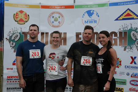 a man and women standing on the starting line