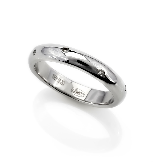 wedding band with diamonds is shown on a white surface