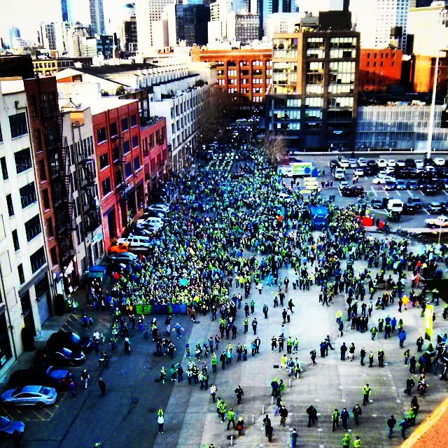 an overhead view of a crowd of people in a parking lot
