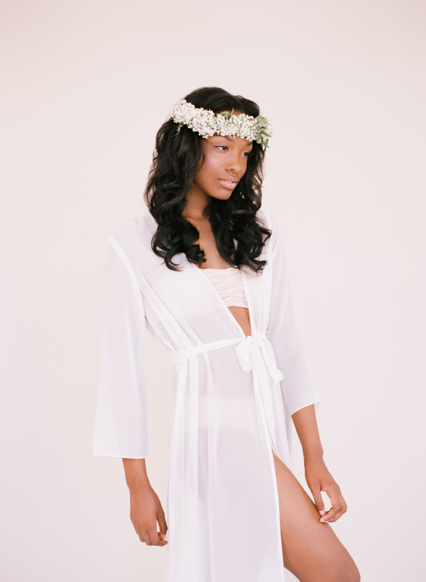 woman in white dress and floral head piece