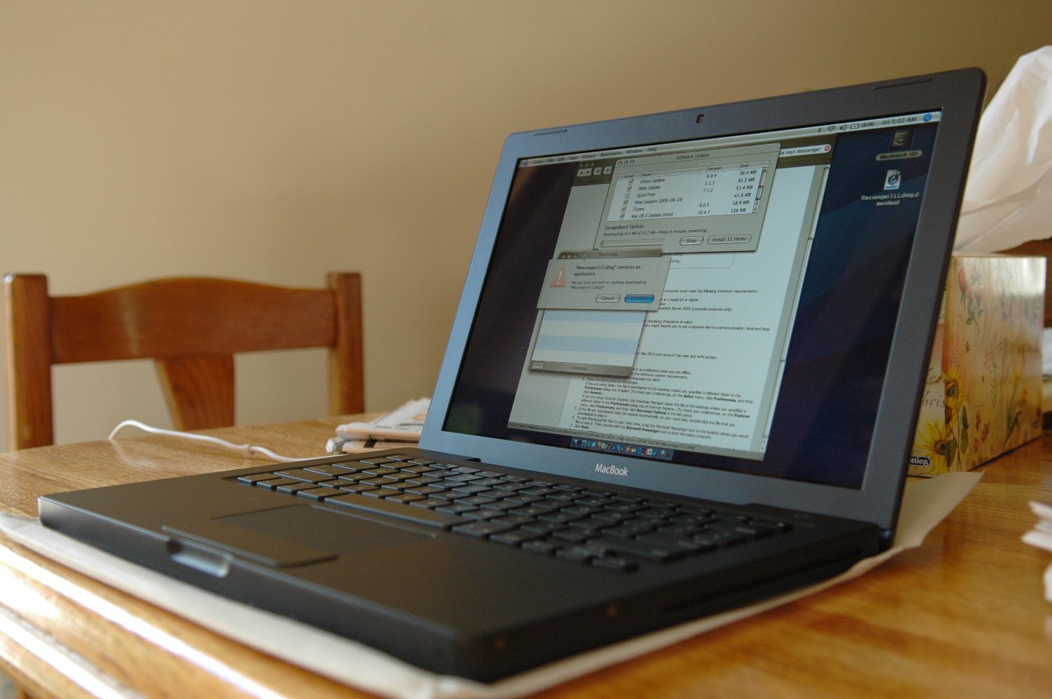 a laptop computer sitting on top of a table