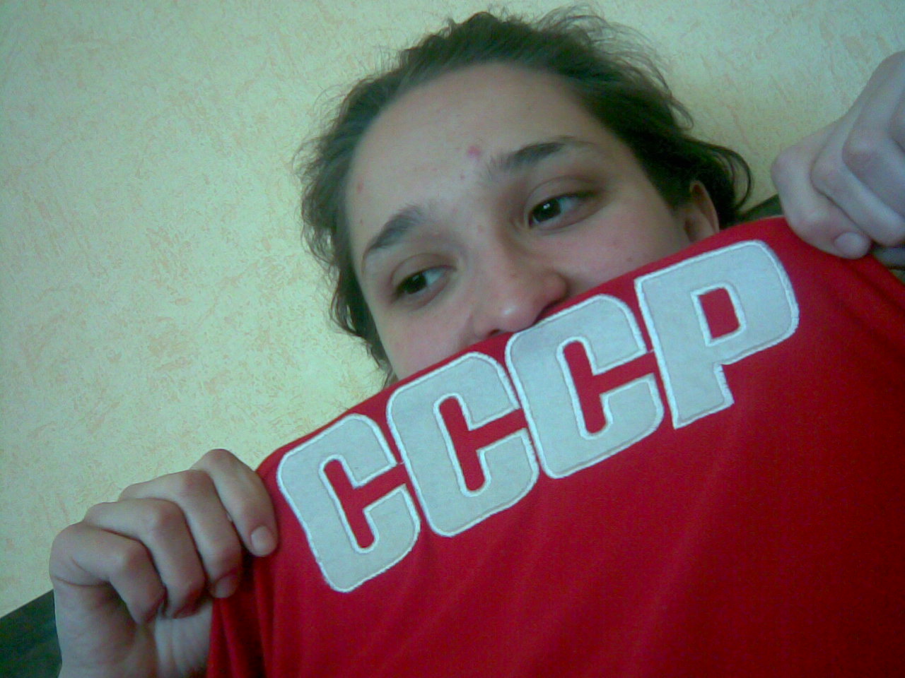a person holding up a t - shirt with the words accept on it