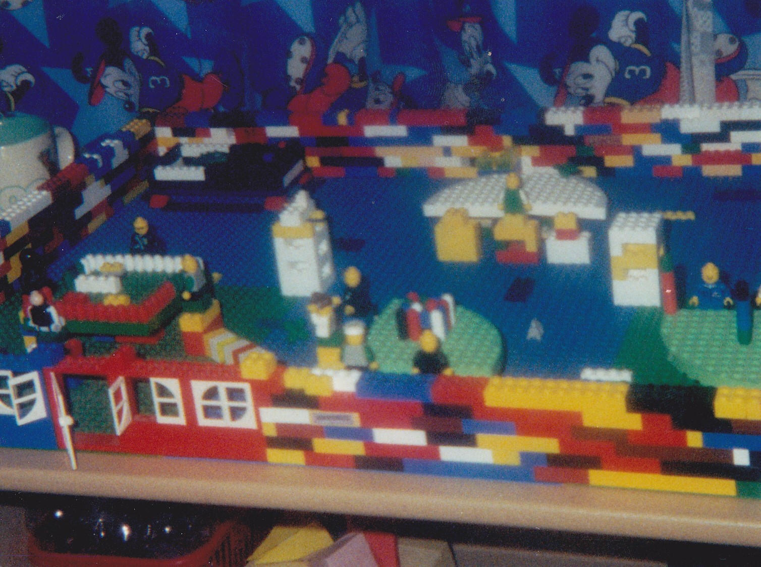 a large table with a lego model of a harbor