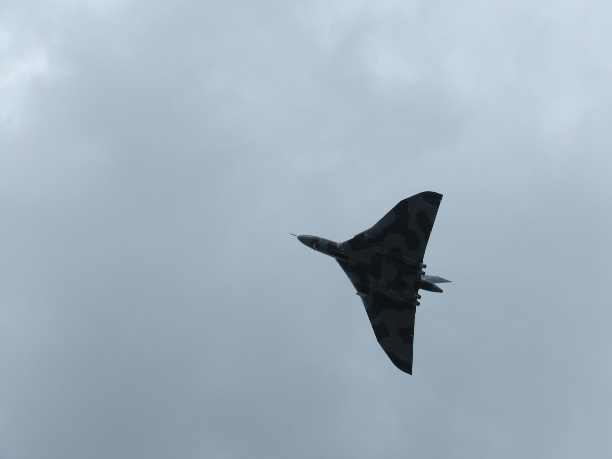 a fighter jet flying through the sky while flying