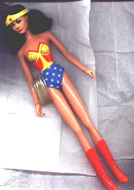 a black and white po of a doll that looks like a wonder woman