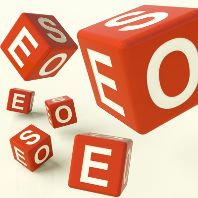 three red and white cubes with some white letters in front