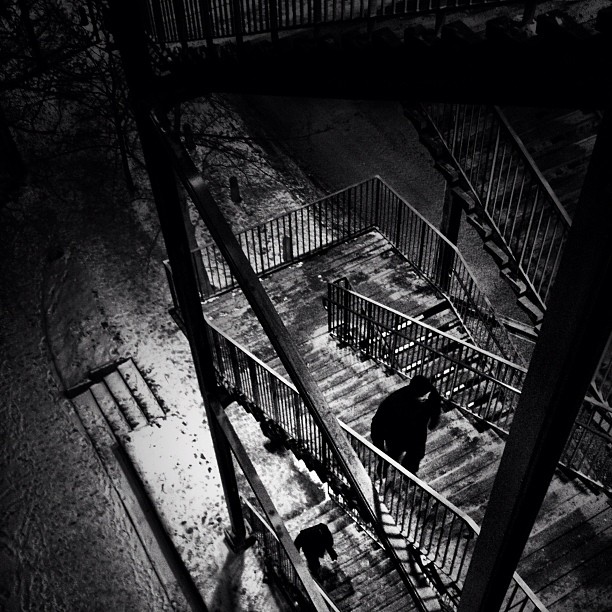 a man walks up some stairs in the dark