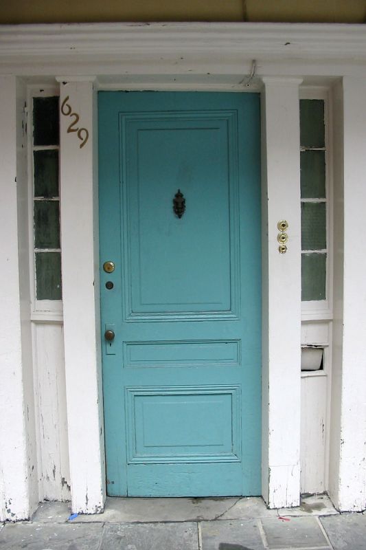 a house with two doors that have numbers on them