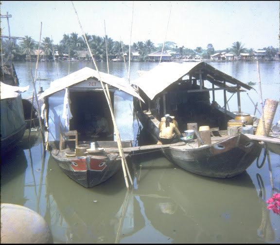 the boats are moored at the small dock in the lake