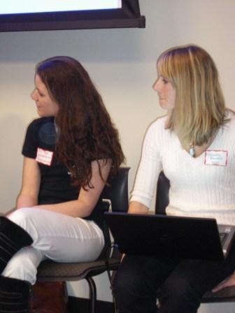 two women are having discussion at an event