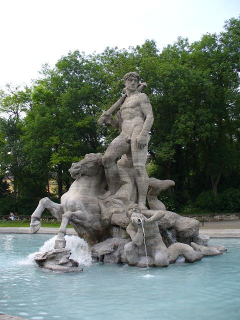 water feature with sculptures and fountains in park setting