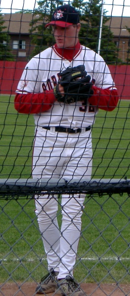 a baseball player standing in the outfield