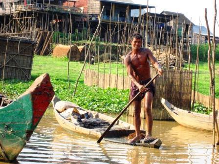 a young man paddles his boat with no poles