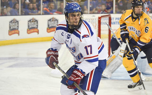 a hockey player with a red white and blue uniform