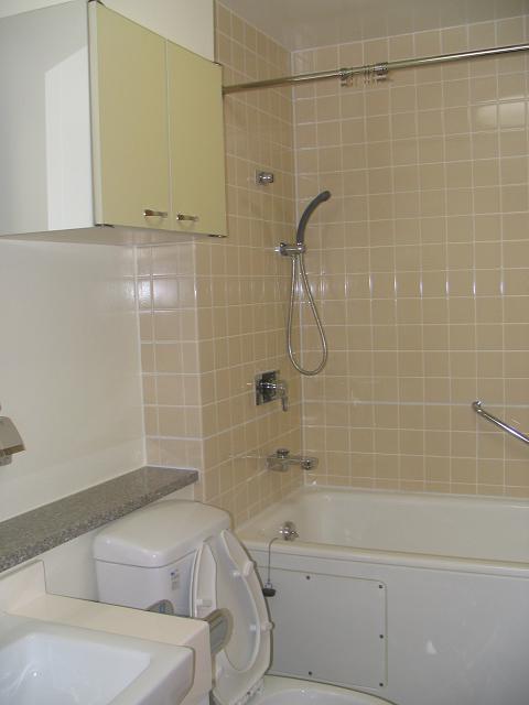 an unfinished bathroom with a toilet, sink and handicap accessible access