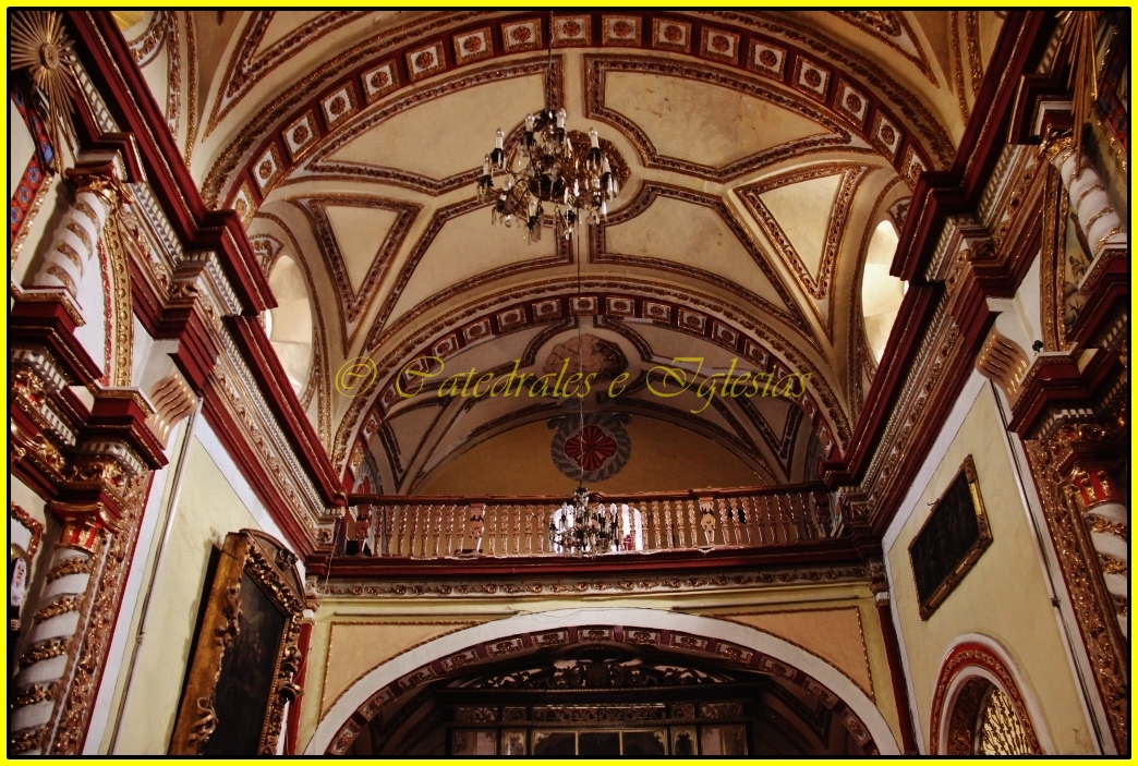 the ceiling in an old building is very ornate