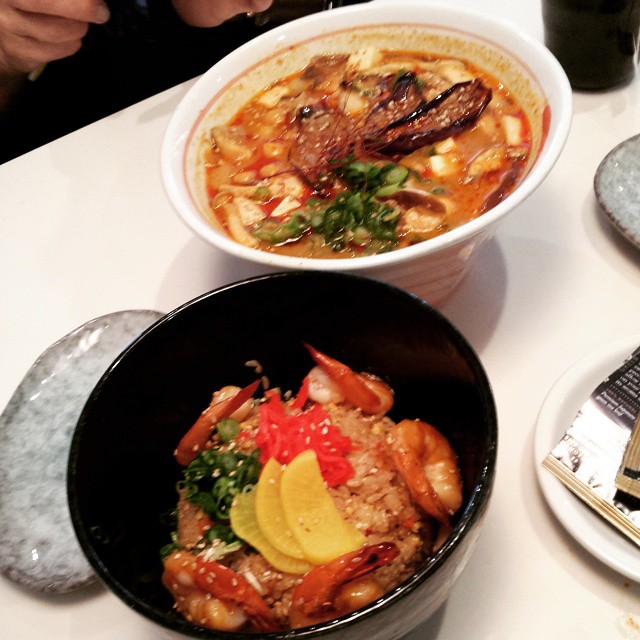 three bowls filled with food on top of a table