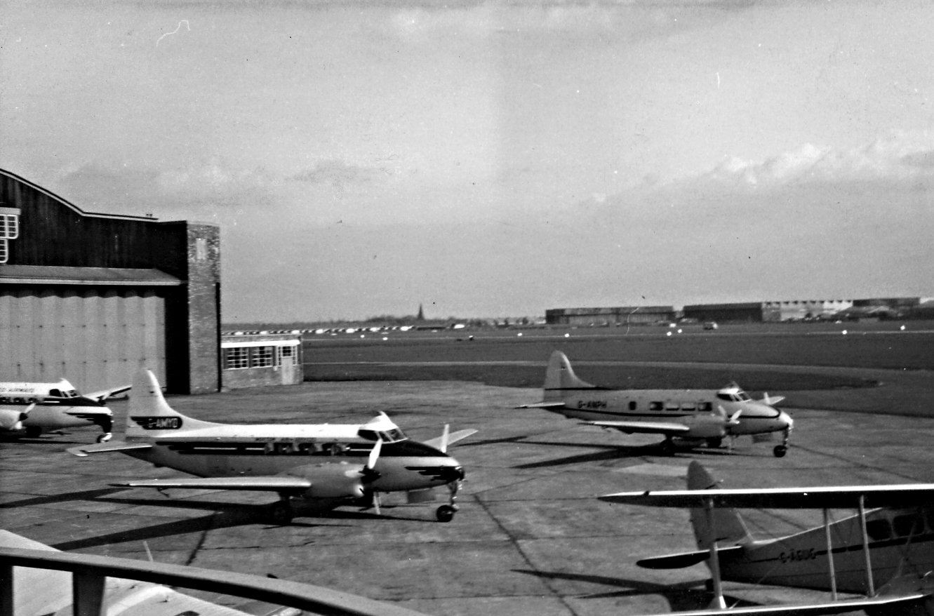 several airplanes are lined up on an airport runway