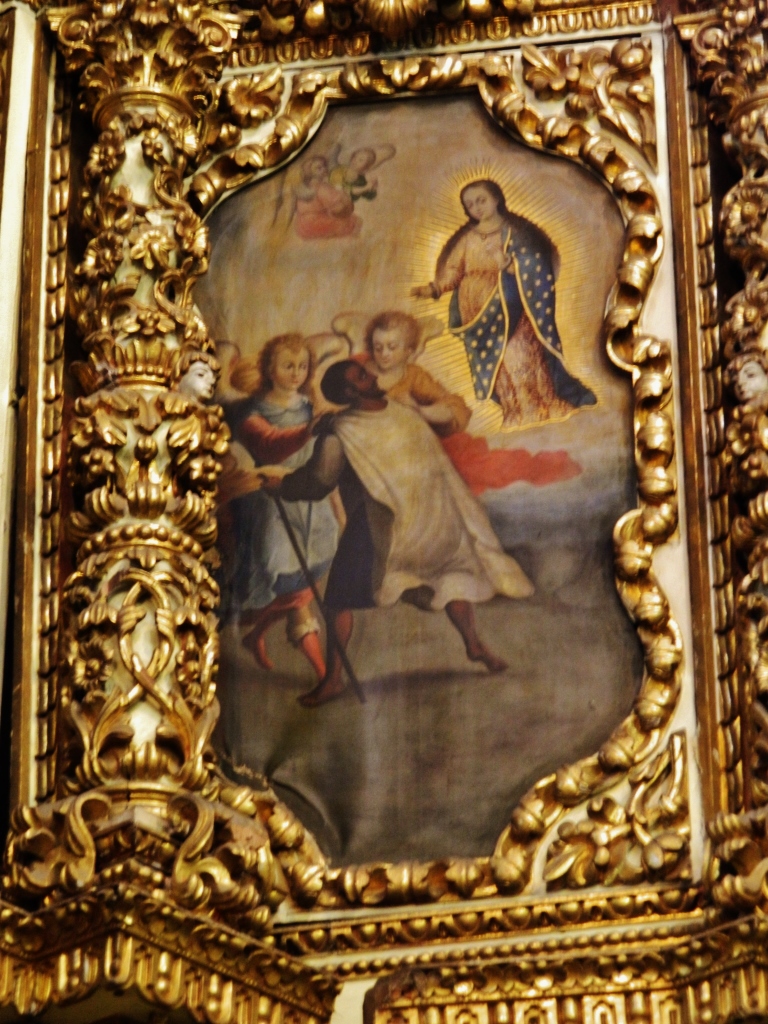 an ornate painted painting of a man being 
