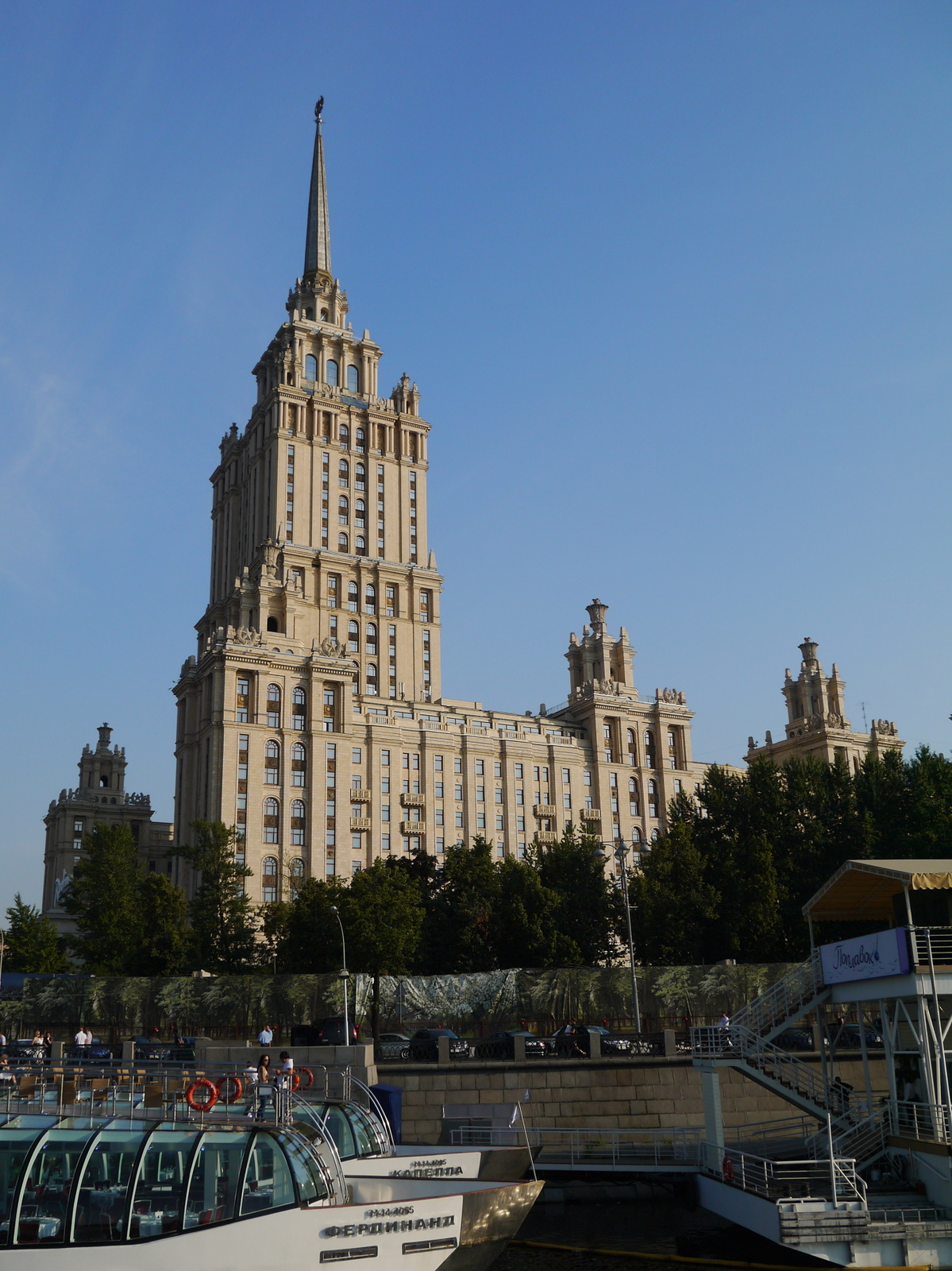 a tall building in a city with many buildings on each side