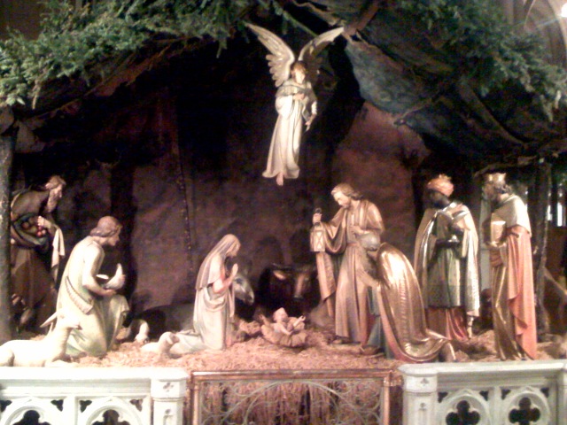 a nativity scene with angels in a manger scene