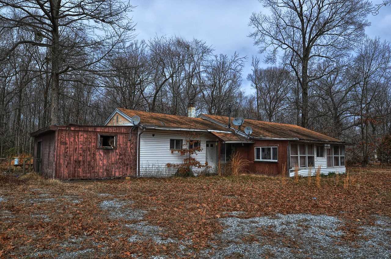 an old abandoned house in the woods near its owners