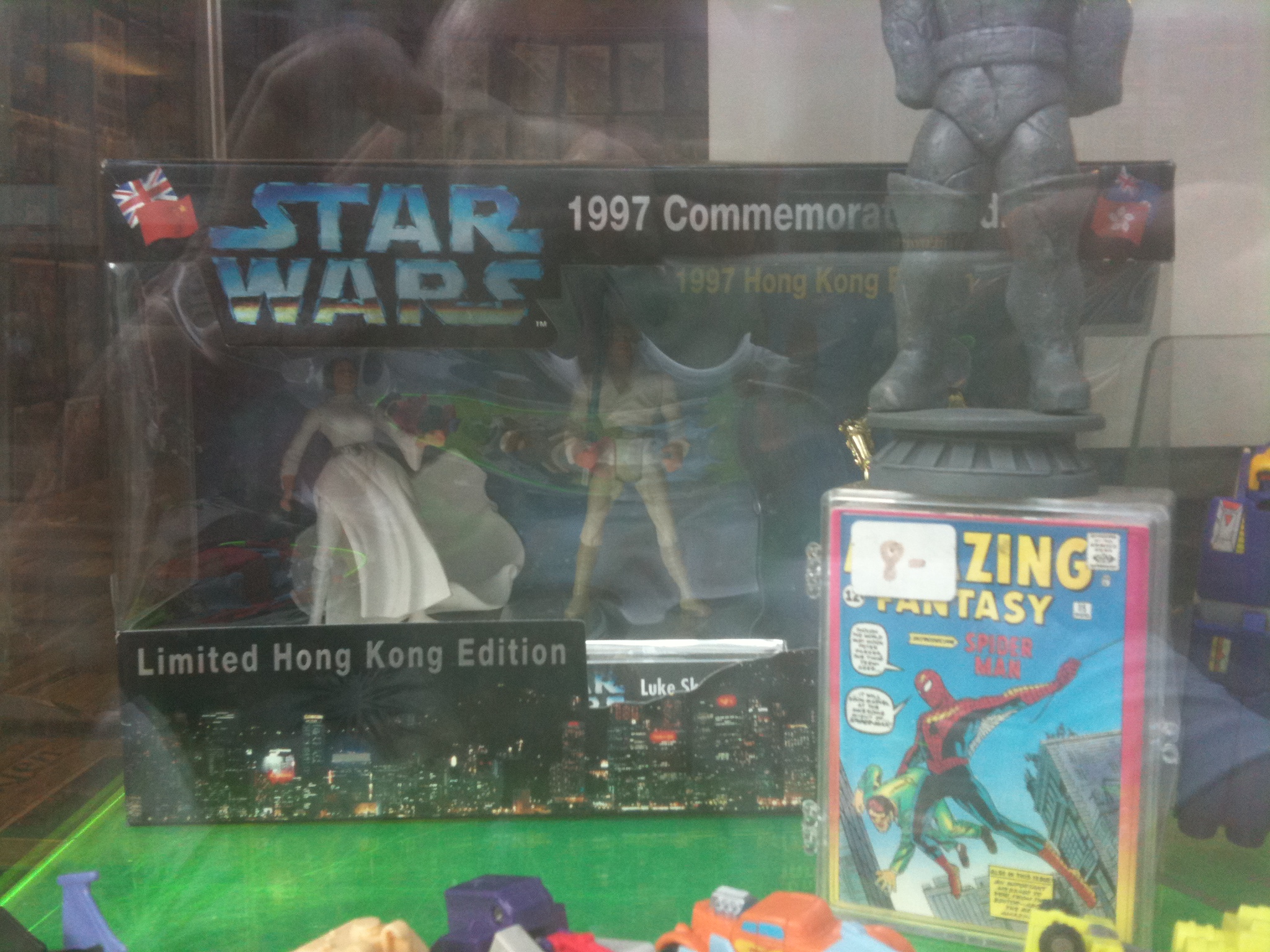 several toy figures on a plastic display case