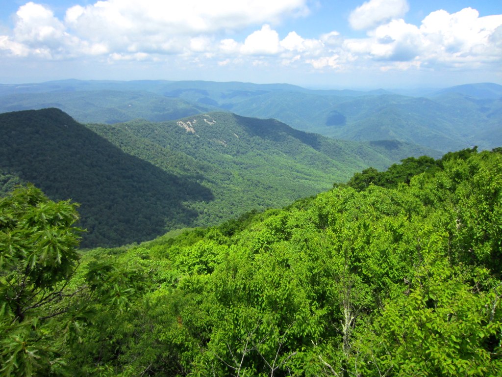 the great smoky blue ridge overlooks mountains with trees and clouds