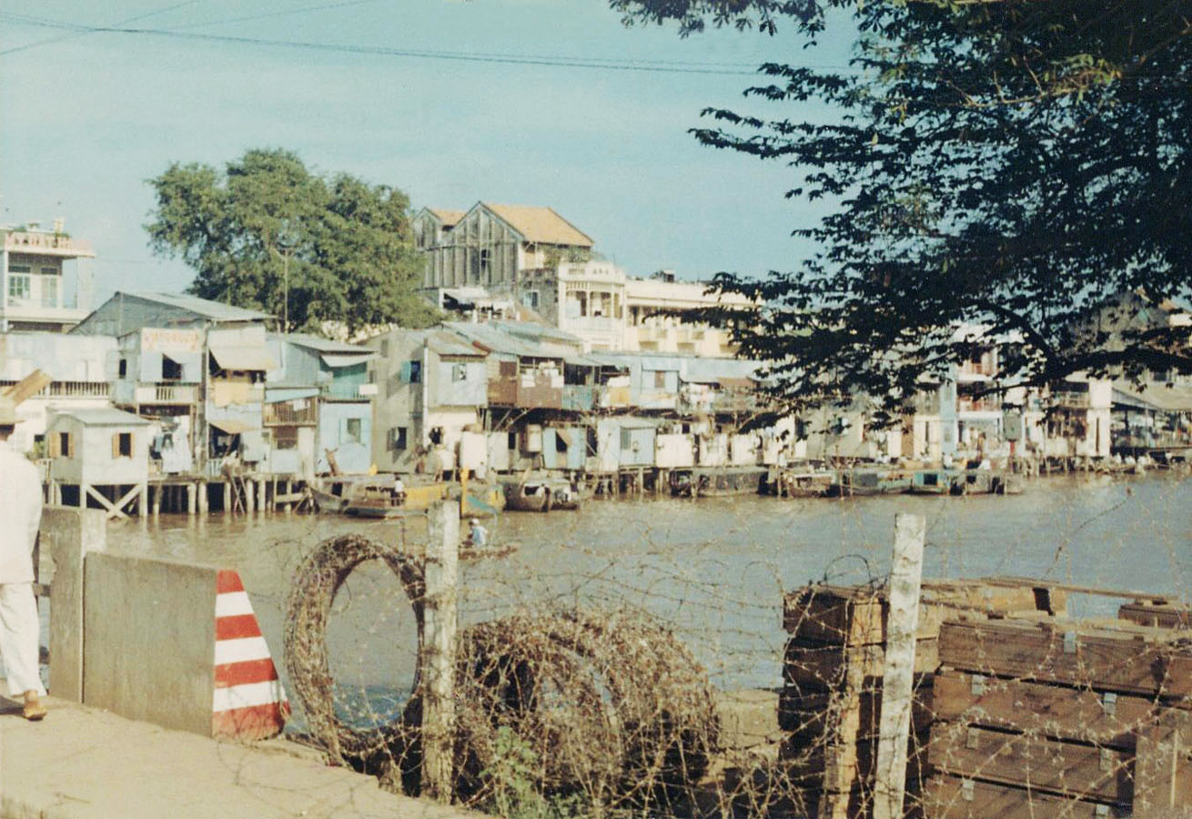 a person standing on the edge of a water way