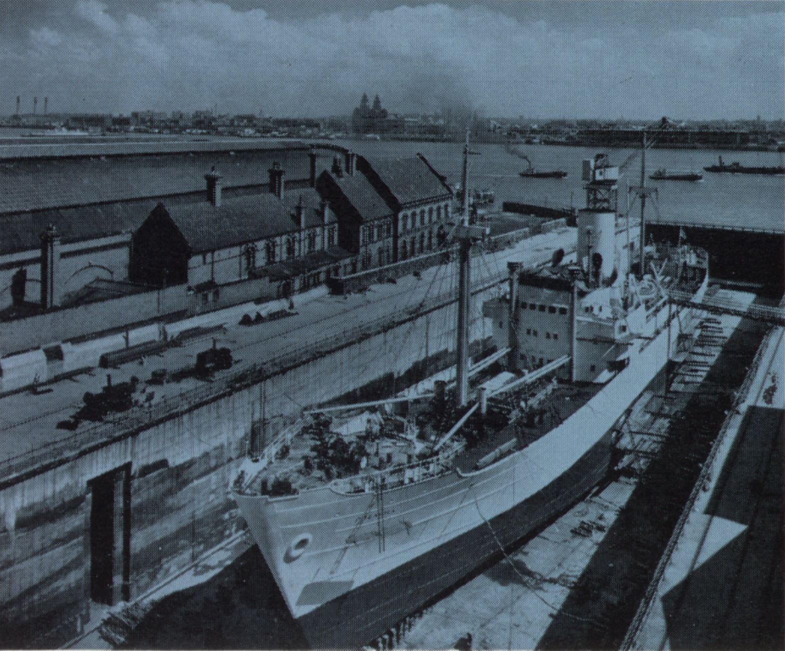 this is an old picture of a factory and buildings