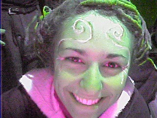 a person is painted in green and purple