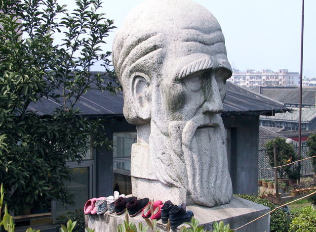 a stone sculpture with a long beard and beard