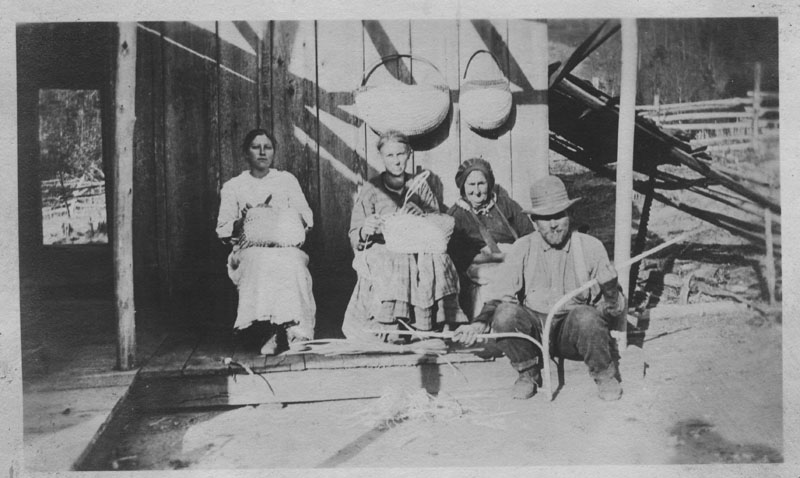 a group of people are standing together with their livestock