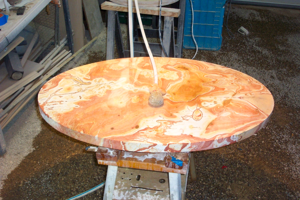 an old wooden table sitting on top of a piece of wood