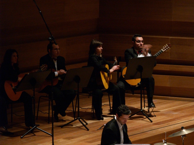 the orchestra and the musician are playing music in the hall