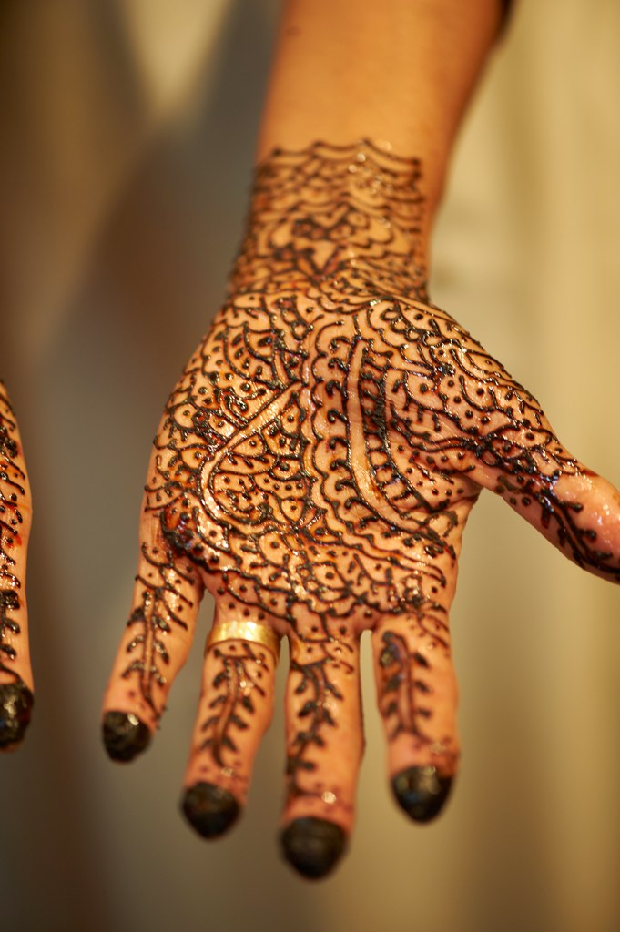 a close up of someones hand showing hendi tattoo